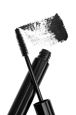 black mascara tube, brush and sample stroke isolated on whiteの写真素材