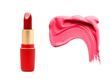 Red lipstick in gold tube and smudged samples isolated on whiteの写真素材