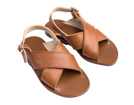 Kids summer leather brown shoes isolated on whiteの写真素材