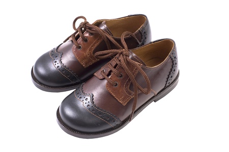 Kids autumn or spring luxury leather brown shoes isolated on whiteの写真素材