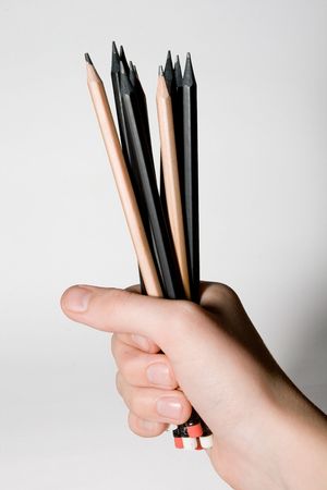 Pencils in a hand on a white backgroundの写真素材