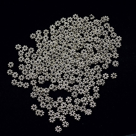 Pile of silver material for making necklace on black backgroundの素材