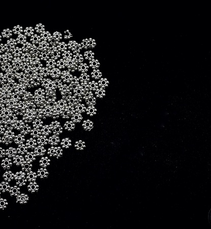 Pile of silver material for making necklace on black backgroundの素材