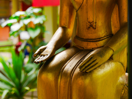 hand of golden buddha statue, hold out one's hand and Upside down handsの写真素材