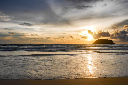 Beautiful beach at evening The sun is setting Beautiful sky Perfect for sunbathing, swimming, reading, a small island in the middle of the sea.の写真素材