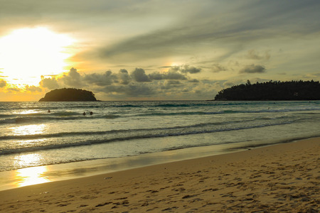 Beautiful beach at evening The sun is setting Beautiful sky Perfect for sunbathing, swimming, reading, a small island in the middle of the sea.の写真素材