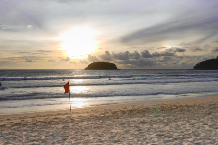 Beautiful beach at evening The sun is setting Beautiful sky Perfect for sunbathing, swimming, reading, a small island in the middle of the sea.の写真素材