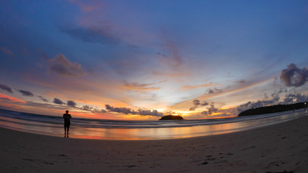 beautiful beach with twilight cloudy sky in the evening.There is an island in the sea.の写真素材