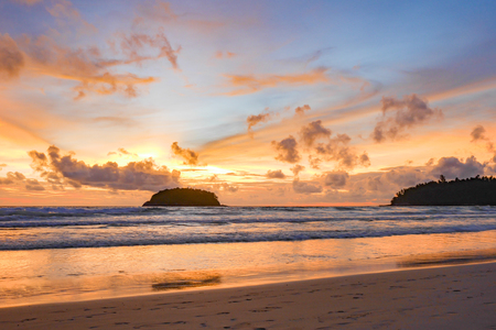 beautiful beach with twilight cloudy sky in the evening.There is an island in the sea.の写真素材