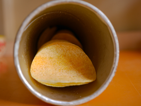 potato chip  in a paper cylindrical bottle.の写真素材