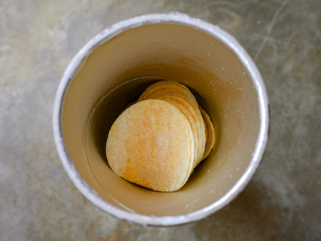 potato chip  in a paper cylindrical bottle.の写真素材