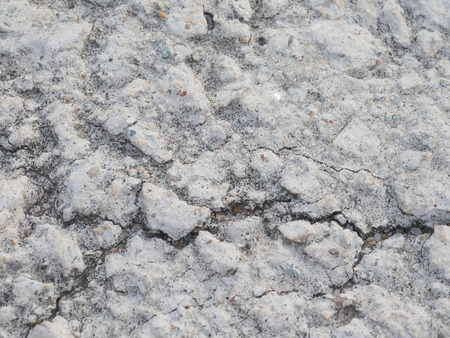 the rough cracked concrete floor surface backgroundの写真素材