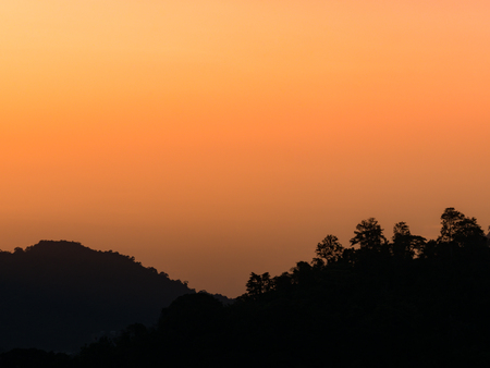 the beautiful  sky with cloudy background and silhouette mountain in twilight time.の写真素材