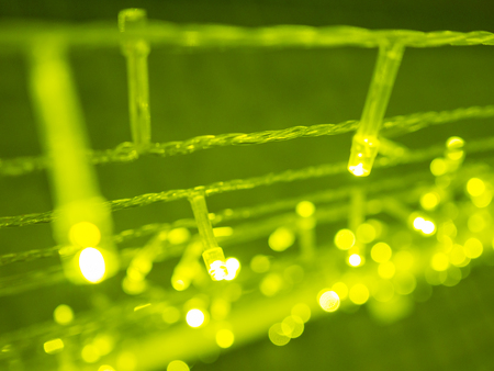 green blurred bokeh light defocused background and textured,  for Christmas , New Year holidays and celebration backgroundの写真素材