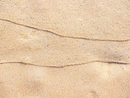 close up sand ground floor at the sea beach , background and textured
