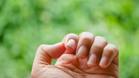 close up man 's finger nail , long and dirtyの写真素材
