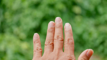 close up man 's finger nail , long and dirtyの写真素材