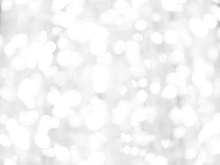 blurred bokeh light defocused background and textured for Christmas , New Year holidays party and celebration background, black and white colourの写真素材