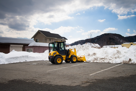 Truck is clearing snow from the parkの写真素材