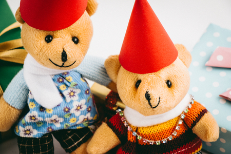 a couple lovely teddy bear and Ornament, Christmas decorate at Merry Christmas and happy new year night light. Christmas tree and other decoration with Lovely gift and ribbon .の写真素材