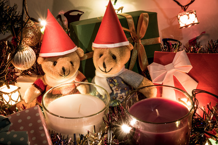 A couple teddy bears, White and violet christmas candle, and  Ornament decorate Merry Christmas and happy new yearの写真素材