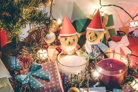 A couple teddy bears, White and violet christmas candle, and  Ornament decorate Merry Christmas and happy new yearの写真素材