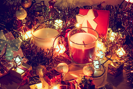 Santa claus hold bell and christmas candle, couple teddy bears and Ornament decorate Merry Christmas and happy new yearの写真素材
