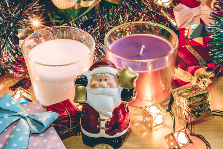 Santa claus hold bell, white and violet christmas candle, Ornament decorate Merry Christmas and happy new yearの写真素材