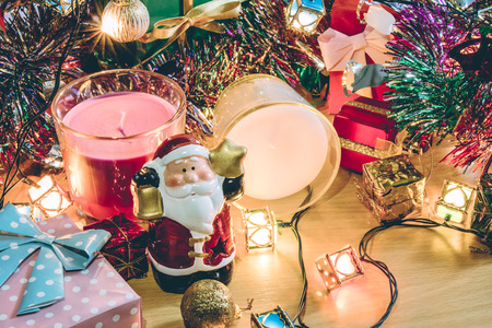 Santa claus hold bell, white and violet christmas candle, Ornament decorate Merry Christmas and happy new yearの写真素材