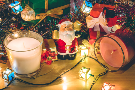 Santa claus hold bell, white and violet christmas candle, Ornament decorate Merry Christmas and happy new yearの写真素材
