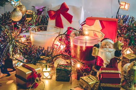 Santa claus hold bell, white and violet christmas candle, Ornament decorate Merry Christmas and happy new yearの写真素材