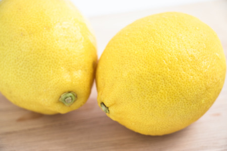 fresh lemon on the chopping block, isolate backgroundの写真素材