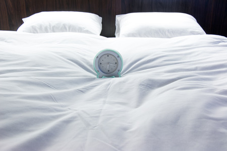 Alram Clock on Double bed in the modern interior roomの写真素材