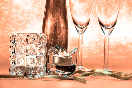 Cool Champagne and glass prepare for Celebration. Candle is lighting in a candlestick in Christmas and New year festival.の写真素材