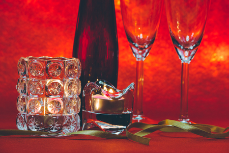 Cool Champagne and glass prepare for Celebration. Candle is lighting in a candlestick in Christmas and New year festival.の写真素材