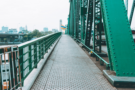 Iron walking way on Memorial Bridge in Bangkok, Choa Praya River,  Thailandの写真素材