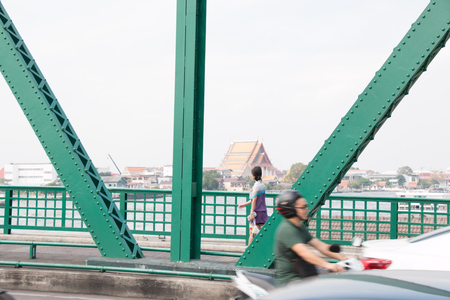 Transportation on iron bridge. Everyday Life, temple, River, and life street in Bangkok, Thailandの写真素材