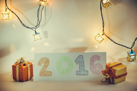 Goodbye 2016. Ornament and Christmas items decorate for the holy night. Merry xmas and happy new year night light.の写真素材
