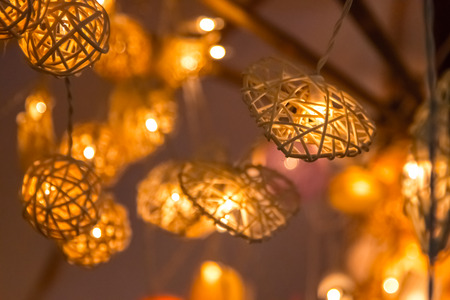 Hanging heart shape Fancy light bulbs with glowing and lighting.の写真素材