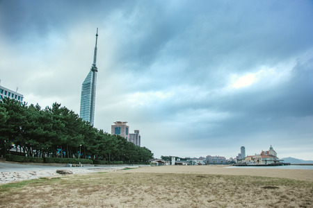 Storm is coming at beach in Fukuoka bay, Kyushu, Japan. City scape of Seaside Momochi, Hakata Downtown CBD and Fukuoka Tower at cloudy dayの写真素材
