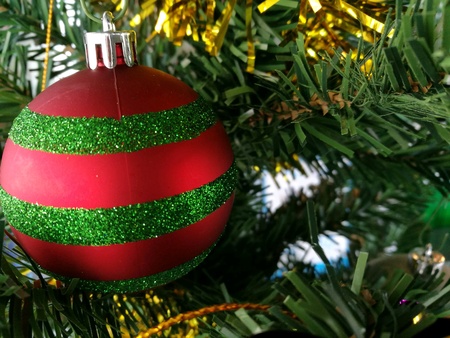 Ornament decor on a christmas tree at silent night. Merry christmas and happy new year.の素材