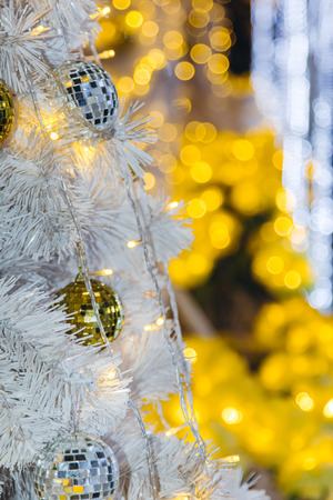 Christmas tree decorated with mirror disco ball. Ornament lighting and gliter decor for celebrate, merry christmas and Happy new year.の写真素材