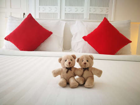 couple bear on bed with white and red pillows inside bedroom, comfort big and white bed king size....