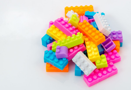 Plastic toy blocks on white background
