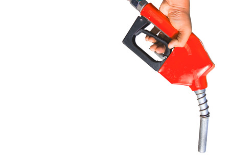Fuel nozzle Hand holding red and white scenes that are separated from the ground.の写真素材