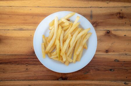 French fries in local dishes on wooden floors