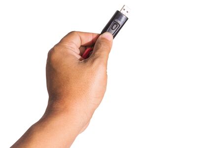 Man's hand holding usb cable on white backgroundの写真素材