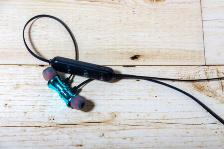 Wireless headphones on the wood floor