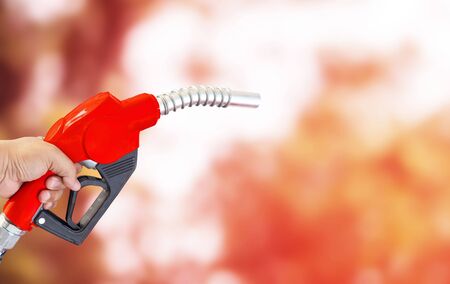 Fuel nozzle Hand holding Oil extracted from the background,の写真素材
