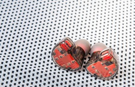 Red headphones on white fabric icon wifi system technology 12 speakers 12.1 channels